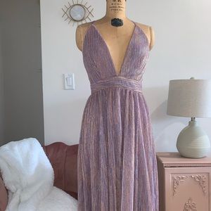 BEAUTIFUL PURPLE SHIMMER LUXXEL GOWN. SIZE SMALL.
